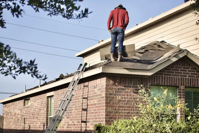 Professional roofer working on a residential roof in Augusta Ranch